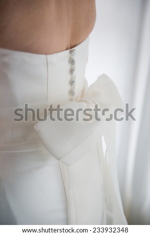 Close up of back of bride's wedding dress detail