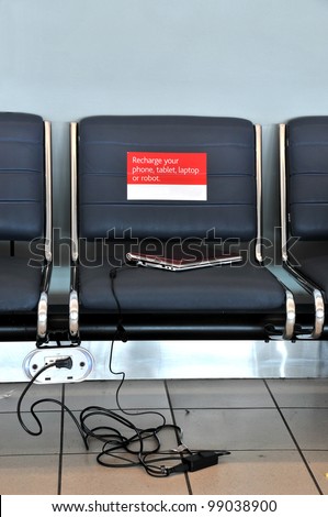 Airport seating with outlet for charging cell phones, computers