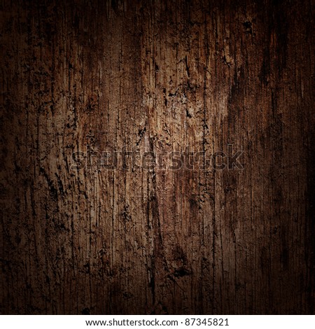 Dark wooden background with moody spot lighting