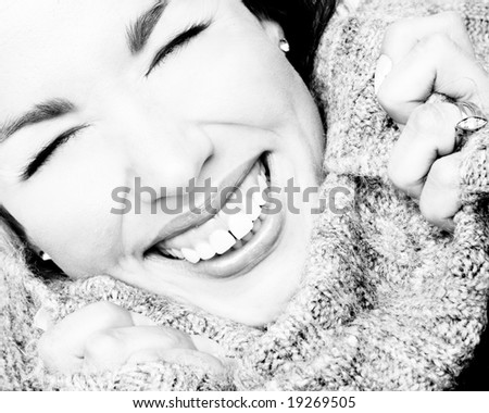 laughing woman close up in black and white