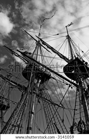 Black and white photo of old ship masts from below.