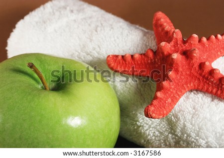 Big green apple and white towel
