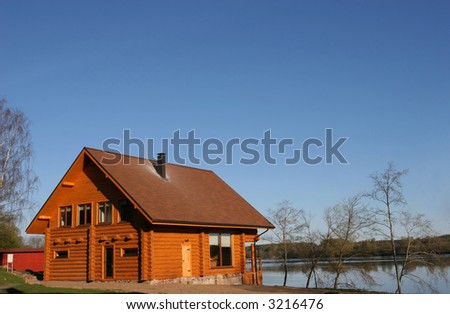 Traditional small wooden house near the river