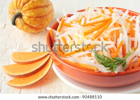 Salad of white radish with pumpkin and mustard oil