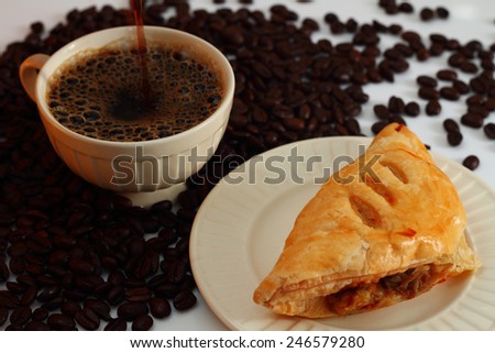 Black coffee ,  coffee bean and mushroom puff pastry.