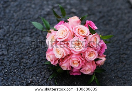 stock photo Beautiful wedding flowers bouquet made of roses on the dark 