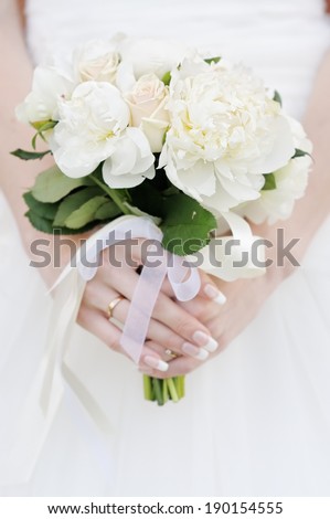 Bride holding wedding flowers bouquet