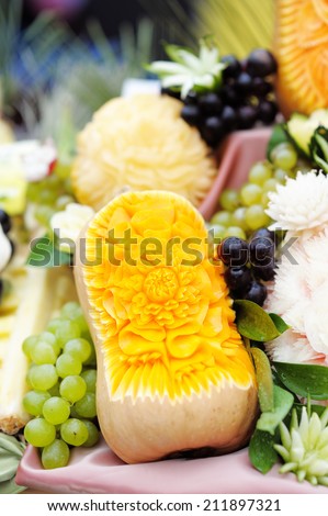 Fruits table with carved pumpkin and grapes