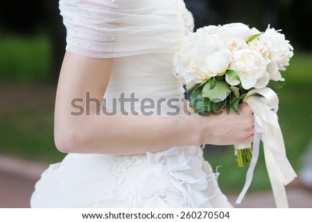 Bride holding wedding flowers bouquet