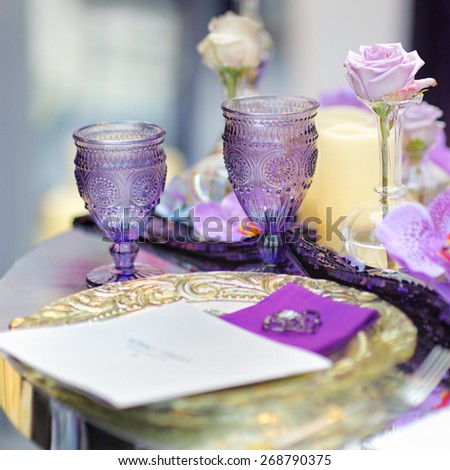 Part of stylish indoor wedding party or date interior with flowers and candles
