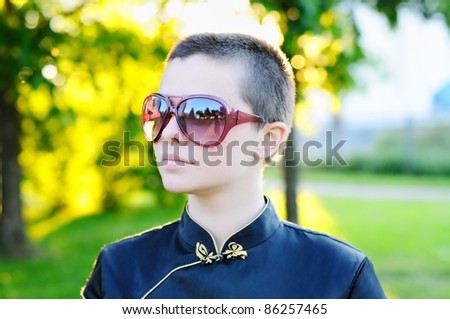 Sunset portrait of young bald woman