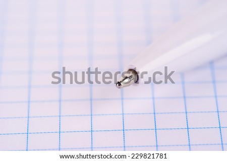 pen on notebook page, school or business background