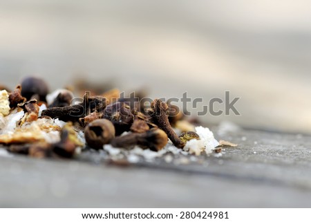 Colorful spices on a wooden background. Indian spices mix. Different pepper, sea salt, cloves.