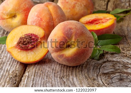 Group Of Fresh Peaches On Wood Background