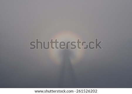 Brocken specter in the mountains fog and light refraction