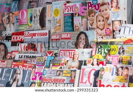 LONDON, UNITED KINGDOM- 1 APRIL 2015: Newsstand found in central London displaying many international titles such as Psychologies Magazine, InStyle, Vogue, Marie Claire and Harperâ??s Bazaar Magazine.