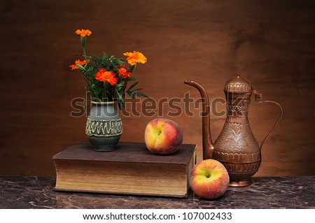 Books, flowers and peaches on the table