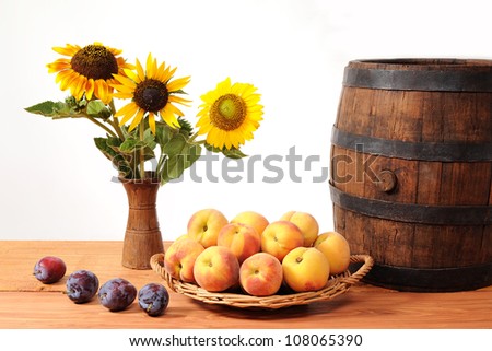 Fruits and flowers barrel on the table