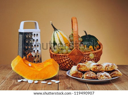 Cakes pumpkin, grapes and decorative pumpkins