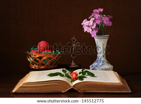 Book and flowers in a vase on the table
