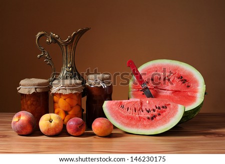 Water melon and apricot jam on the table