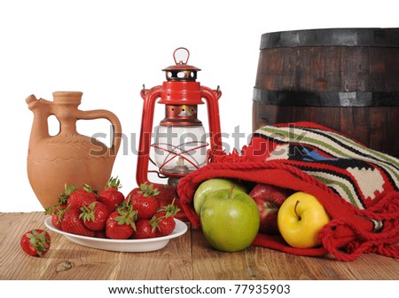 Strawberries and apples on a wooden table