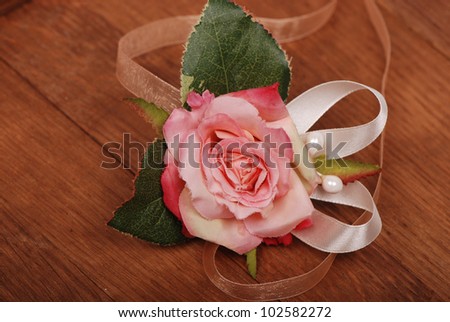 Studio image of textile flower handmade fabric over wooden background/decorative flower