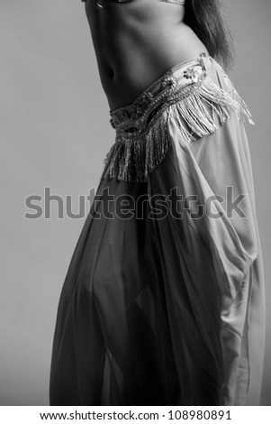 Black and white Art photo of beautiful young body of the belly dancer