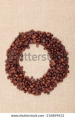 round frame and linen texture/Round symbol of coffee beans