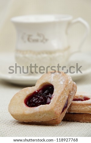 Tea with heart symbol cookies in focus on Food and Drink theme