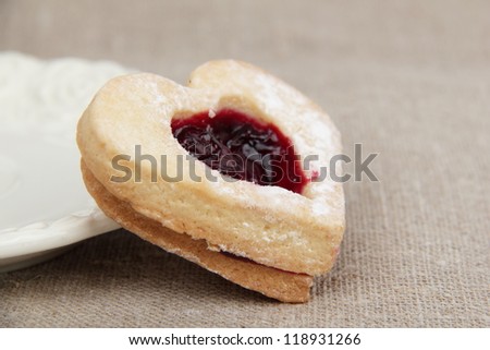 Heart-shaped biscuit  with sweet jam inside on tea time on Sign and Symbol theme