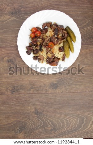 Studio image of pasta with mushrooms and small tasty tomatoes on Food and Drink theme/Vegetarian dish as a pasta and mushrooms