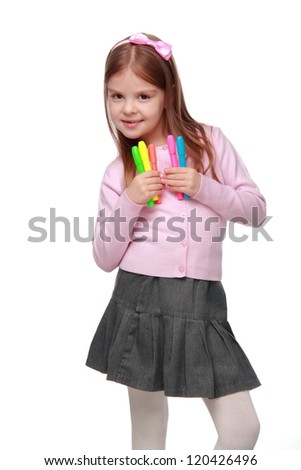 Image of school girl wearing classical gray skirt and pink blouse and holding colorful felt-tip pens on Education and Art theme/Happy beautiful little girl with felt-tip pens