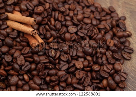 Dark brown coffee beans and cinnamon on Food and Drink theme