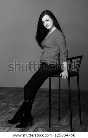 Studio image of black and white portrait pretty woman on Beauty and Fashion theme/Black and white portrait of a young smiley beautiful european woman