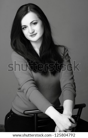 Studio image of black and white portrait pretty woman on Beauty and Fashion theme/Portrait of a young smiley beautiful european woman