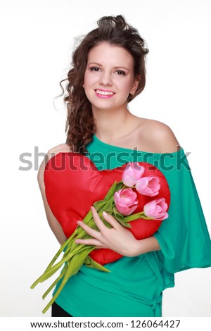 Beautiful face of brunette curly hair girl positive energy with lovely pink tulips