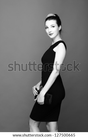 Black and white image of a beautiful model in a dress for cocktails