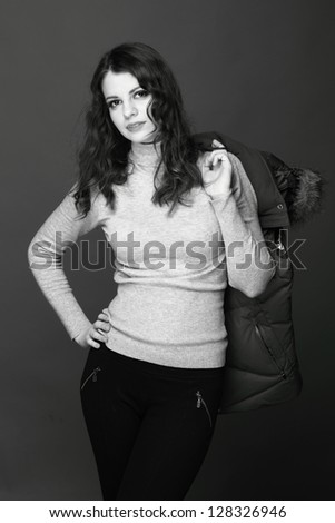 Black and White portrait of trendy girl in winter clothes