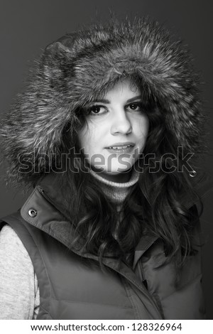 Black and white picture fun girl in winter clothes