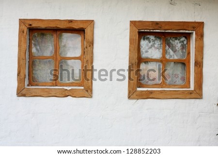 Outdoor image of traditional ukrainian window/An old window in a wooden frame