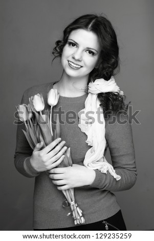 Black and White image of woman/Retro photo of a cute girl with flowers