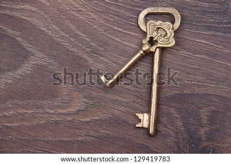 Antique metal keys on dark wooden background/Vintage  keys