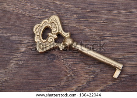 Vintage key pattern/Old key on dark wooden background