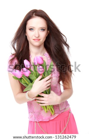Beautiful girl in a summer dress with pink tulips on Holiday/Pretty girl in pink blouse on Beauty and Fashion