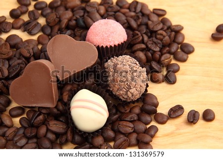sweet chocolate hearts on dessert menu on dark brown coffee beans on Holiday theme