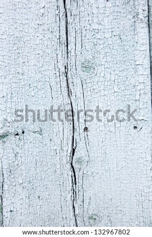 Old paint on a wooden wall/Old wooden planks with cracked light paint
