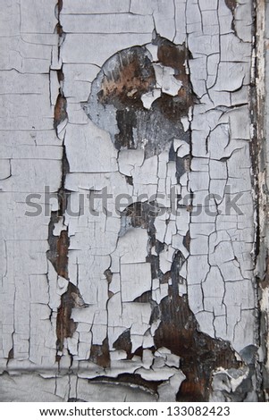 Background of the old brown wood with old paint/Old wooden planks with cracked paint