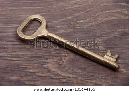 Vintage key on a beautiful wooden background with a pattern/Bunch of antique keys