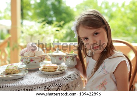 Outdoor image of cute girl with tea